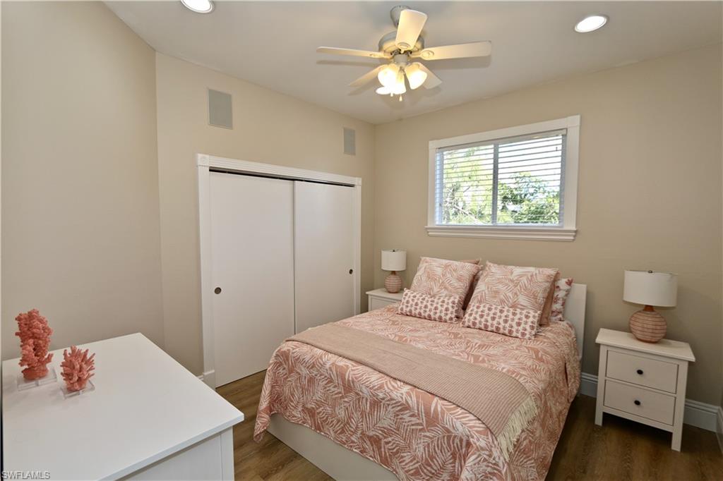 2855 Coach House Way Naples, FL 34105 - Photo 25 of 42 Bedroom featuring recessed lighting, wood finished floors, a closet, and a ceiling fan