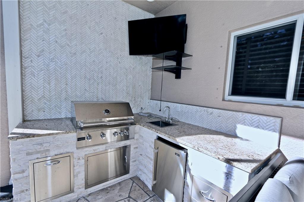 2855 Coach House Way Naples, FL 34105 - Photo 37 of 42 View of patio / terrace featuring exterior kitchen and a sink