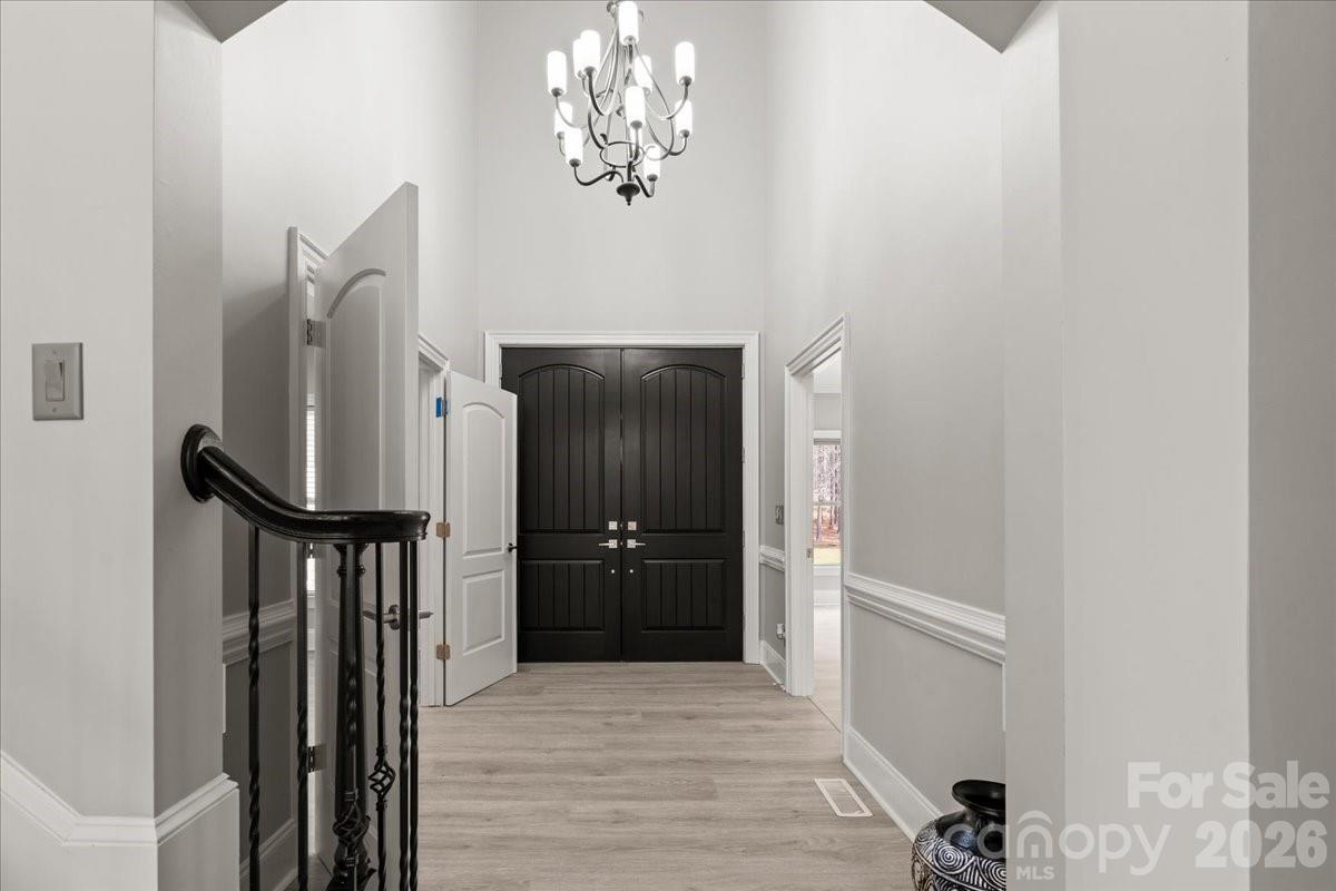 962 Miller Road Jefferson, SC 29718 - Photo 14 of 48 a view of a hallway with wooden floor and staircase