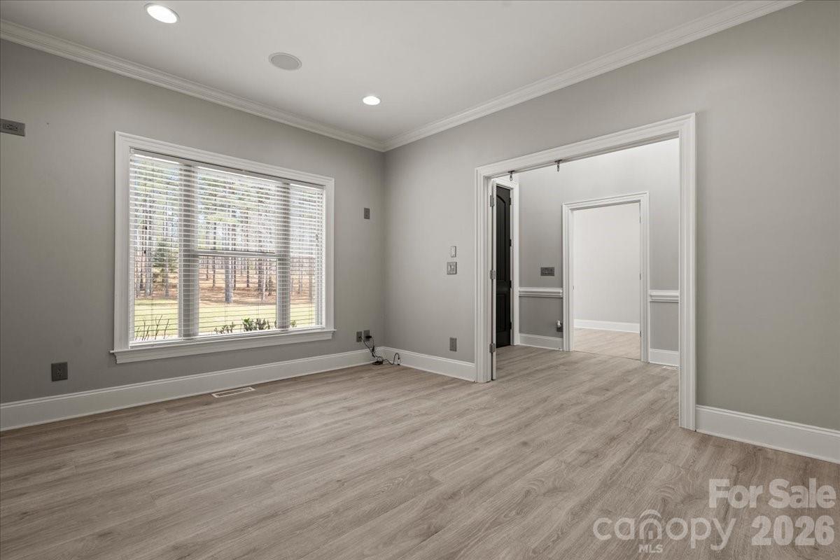 962 Miller Road Jefferson, SC 29718 - Photo 15 of 48 a view of an empty room with wooden floor and a window