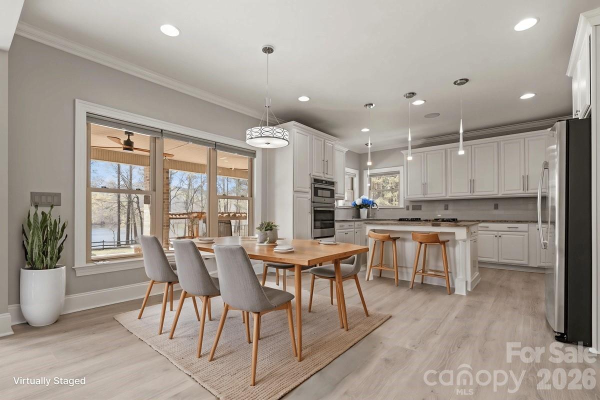 962 Miller Road Jefferson, SC 29718 - Photo 22 of 48 a view of a dining room with furniture and wooden floor