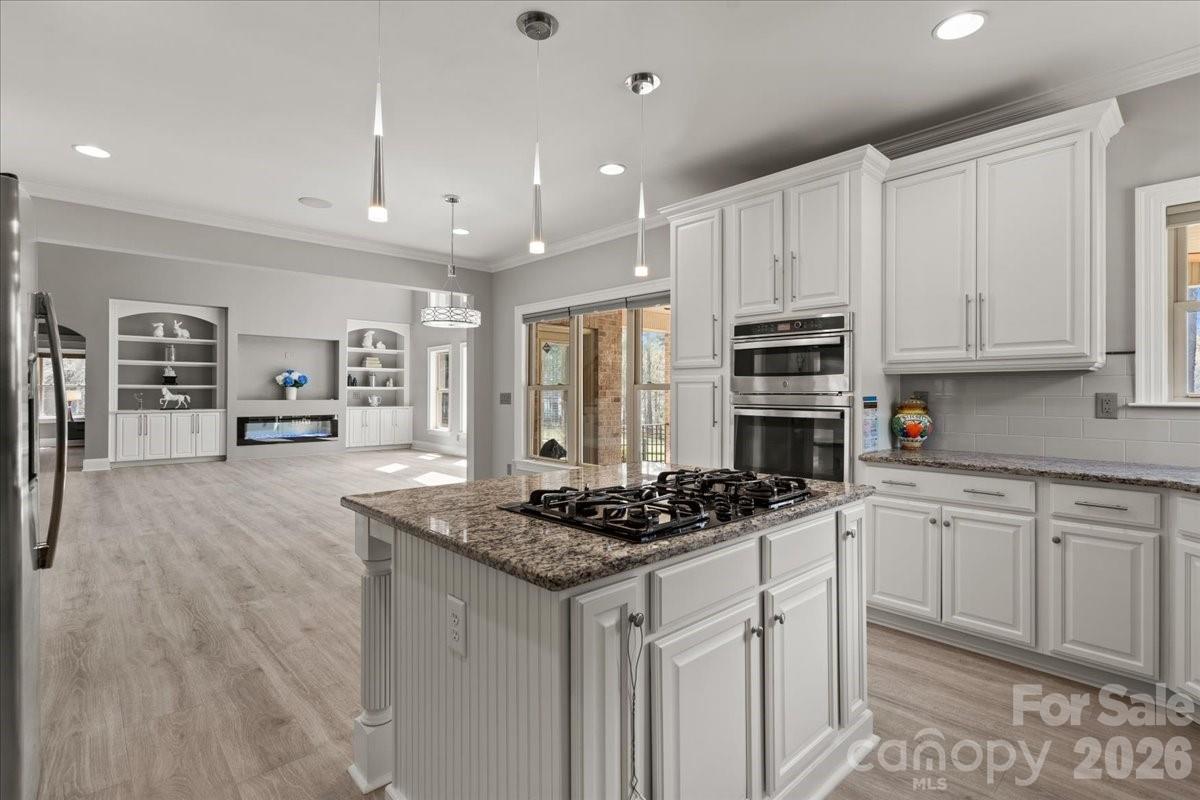 962 Miller Road Jefferson, SC 29718 - Photo 23 of 48 a kitchen with stainless steel appliances granite countertop a stove and cabinets