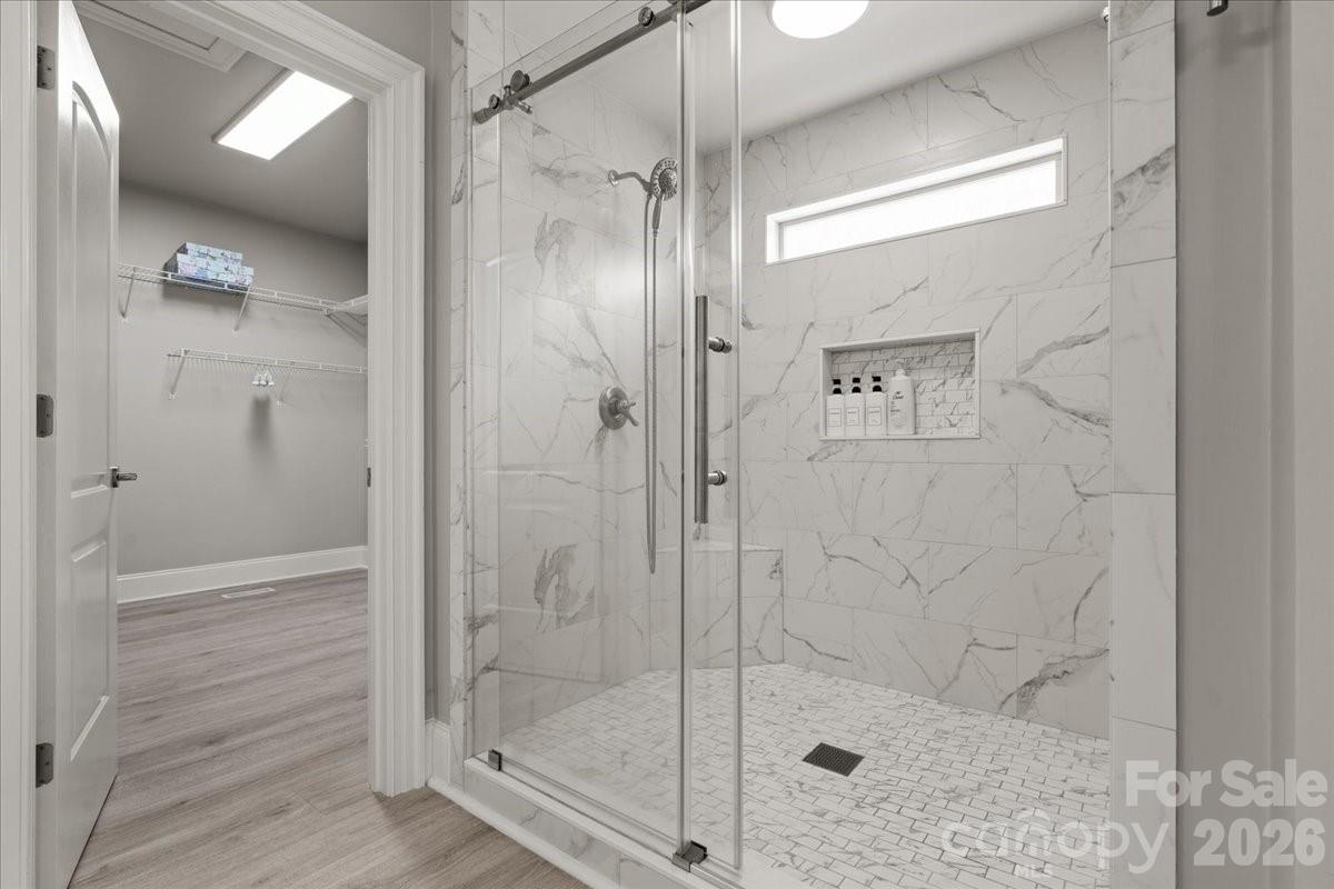 962 Miller Road Jefferson, SC 29718 - Photo 28 of 48 a bathroom with a glass shower door