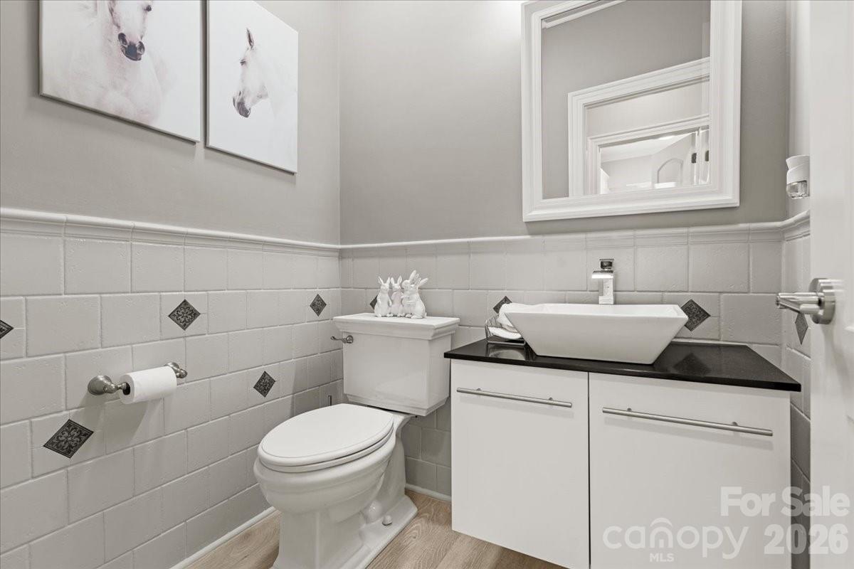 962 Miller Road Jefferson, SC 29718 - Photo 30 of 48 a bathroom with a toilet sink and mirror