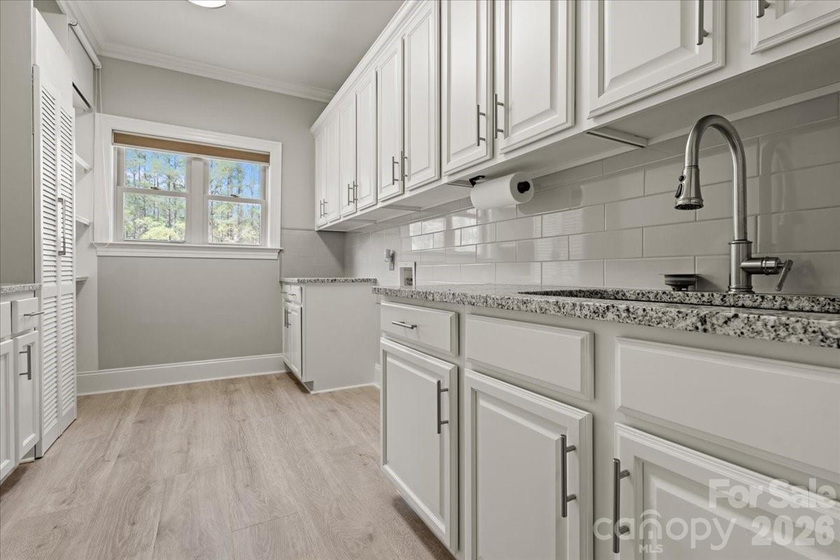 962 Miller Road Jefferson, SC 29718 - Photo 31 of 48 a kitchen with granite countertop white cabinets and white appliances