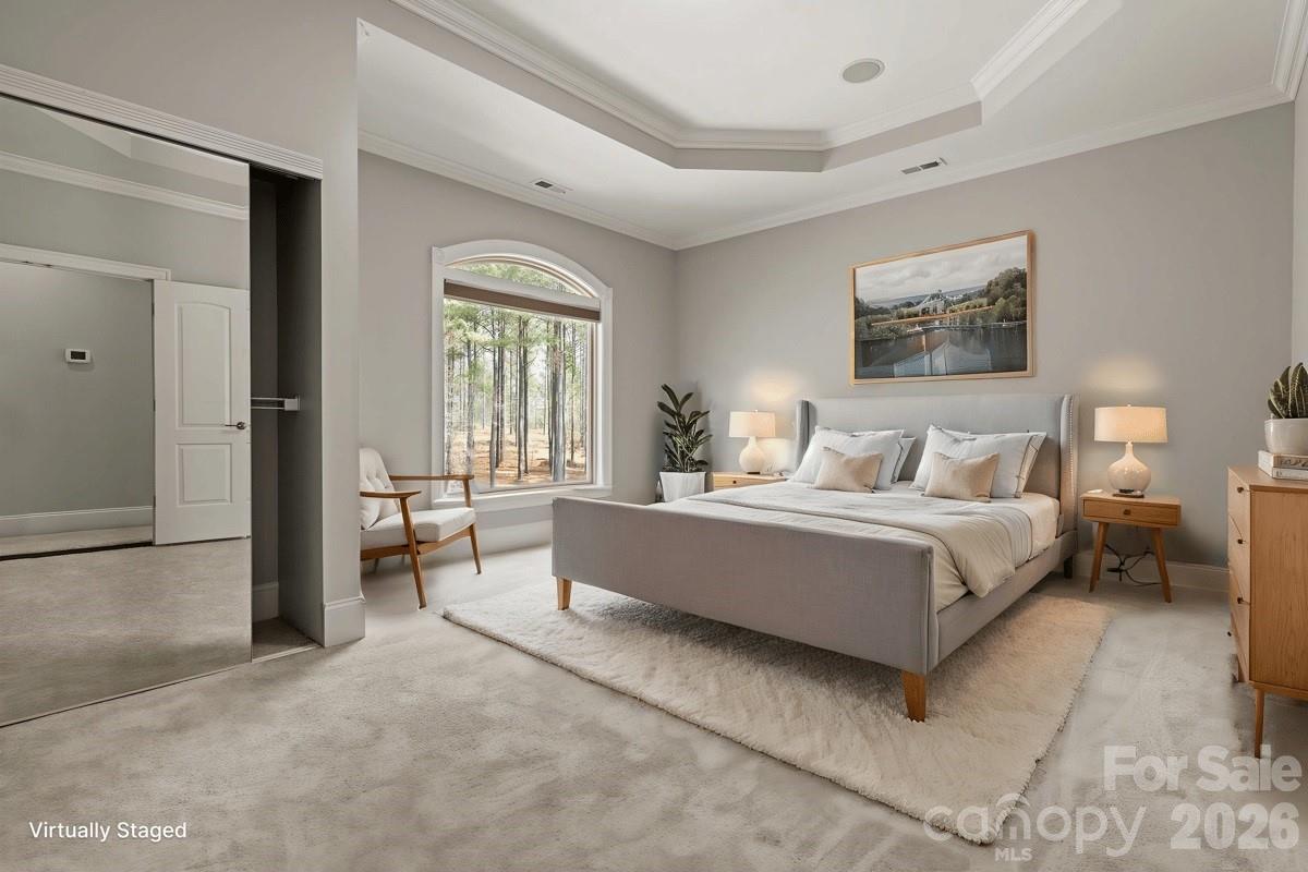 962 Miller Road Jefferson, SC 29718 - Photo 33 of 48 a spacious bedroom with a bed and a couch