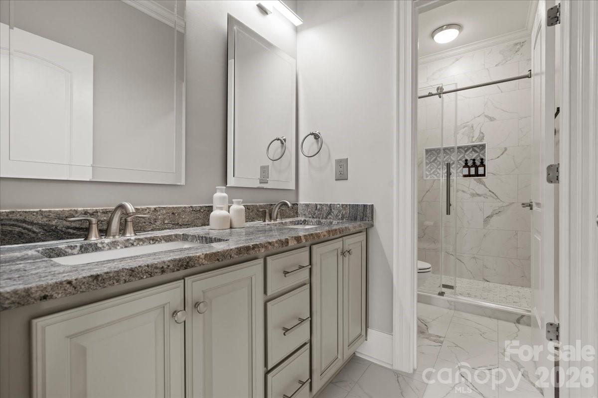 962 Miller Road Jefferson, SC 29718 - Photo 34 of 48 a bathroom with a granite countertop sink mirror and a bath tub
