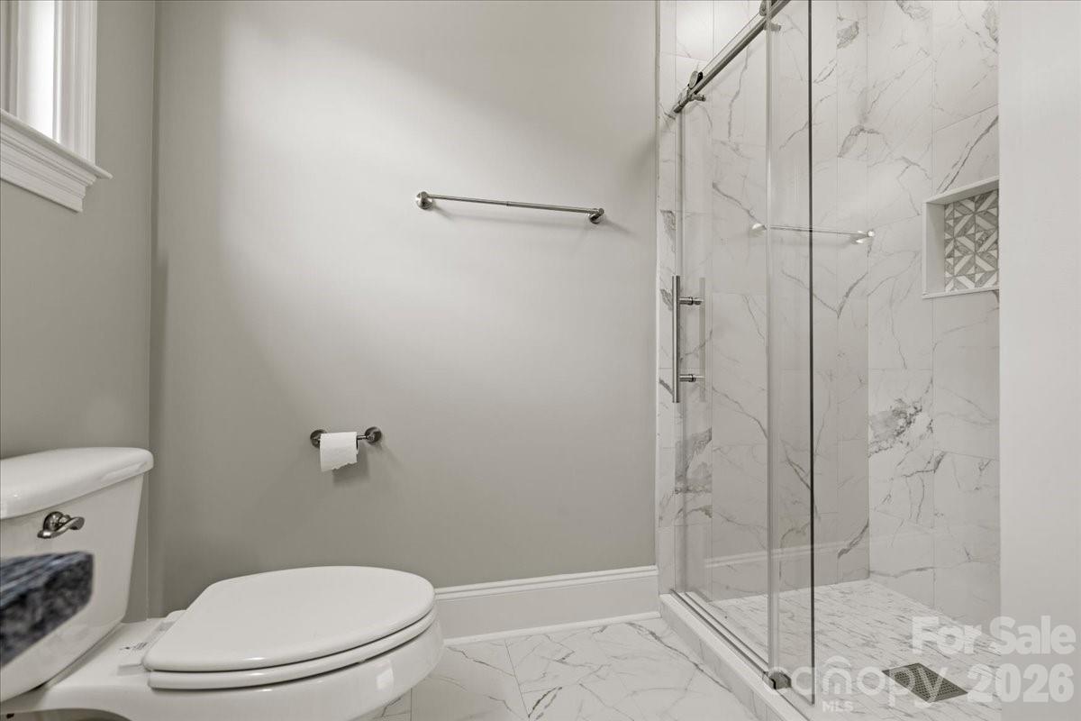 962 Miller Road Jefferson, SC 29718 - Photo 38 of 48 a white toilet sitting next to a bathroom