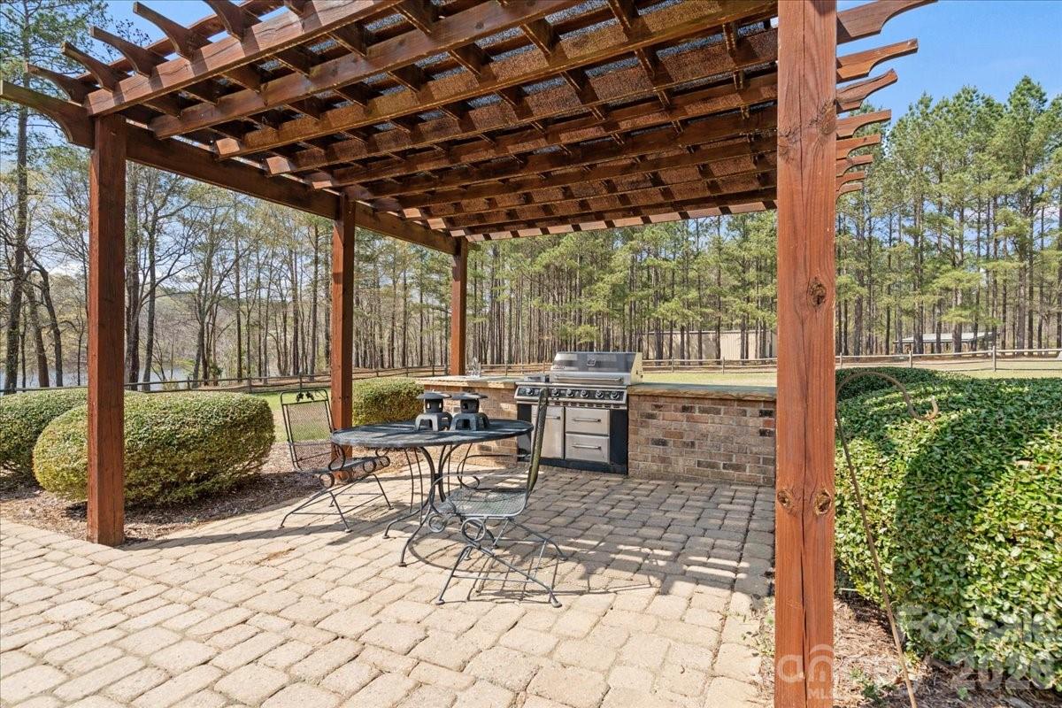 962 Miller Road Jefferson, SC 29718 - Photo 42 of 48 a view of a porch with chairs and backyard