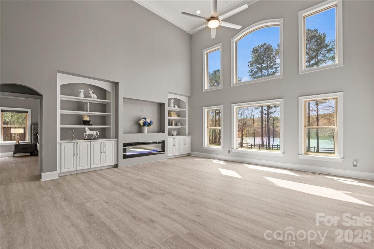 962 Miller Road Jefferson, SC 29718 - Photo 9 of 48 a view of an empty room with wooden floor and a window