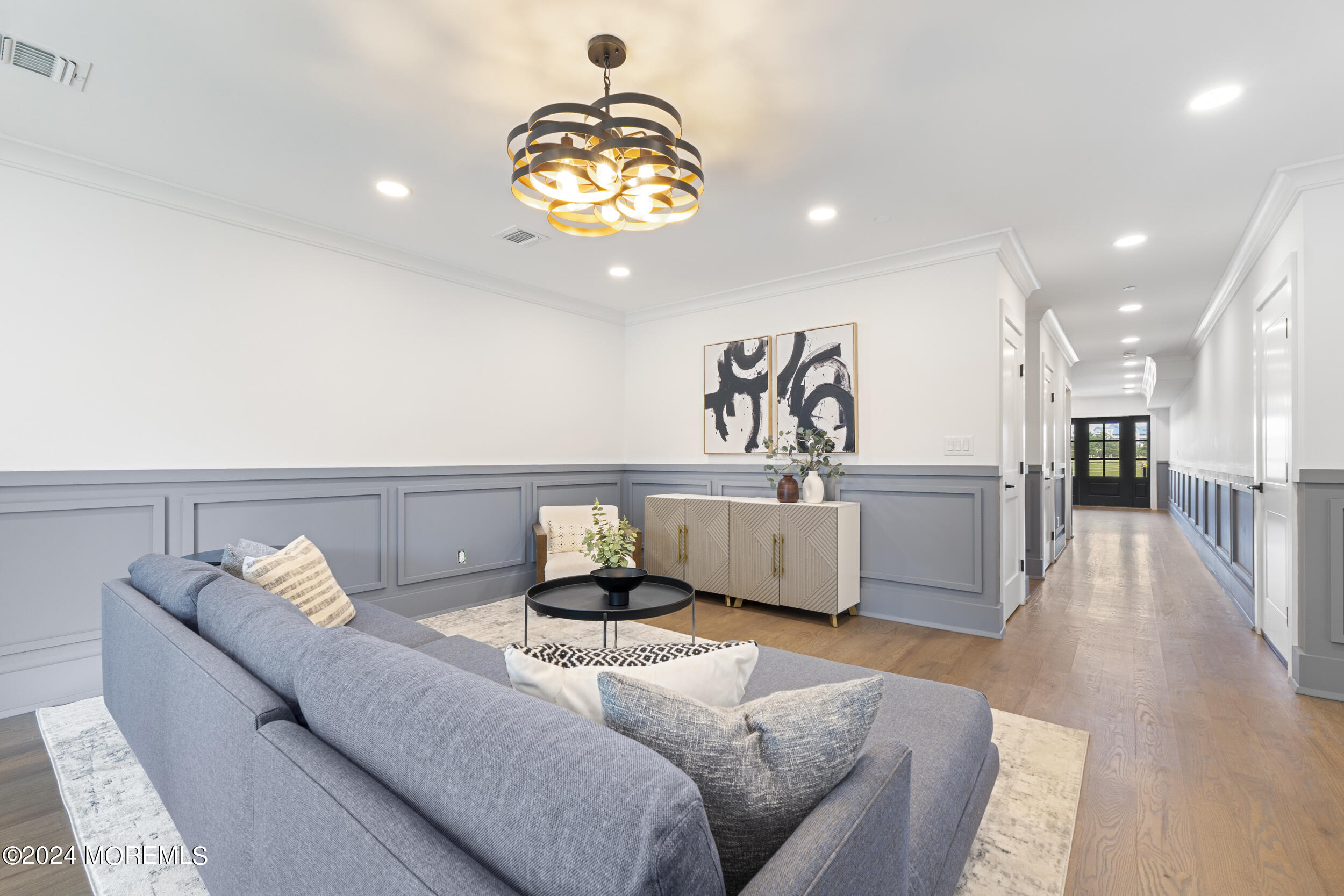 40 Seaview Avenue, Unit A Long Branch, NJ 07740 - Photo 12 of 62 a living room with furniture and a chandelier