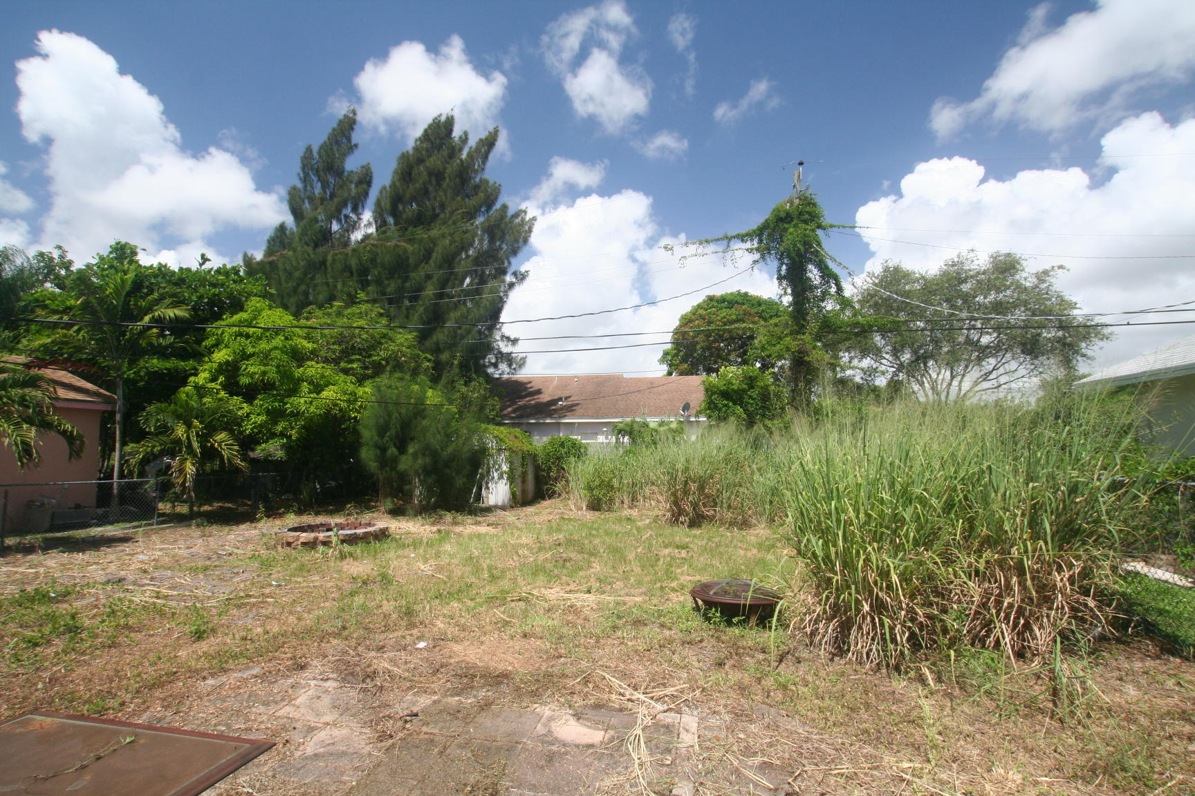 14925 Whatley Road Delray Beach, FL 33445 - Photo 7 of 8 a backyard of a house with lots of green space