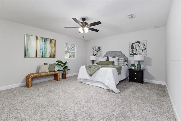 a bed room with a bed and a couch