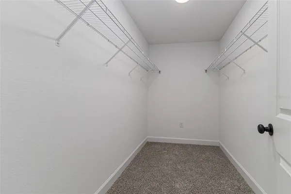 a view of a room with racks on the wall