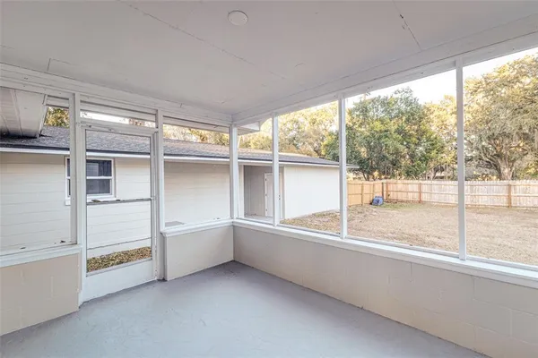 a view of an empty room with a window