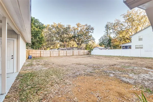 a view of empty room with tree s