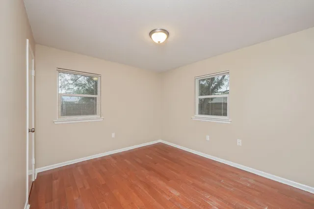 a view of room with window and ceiling fan