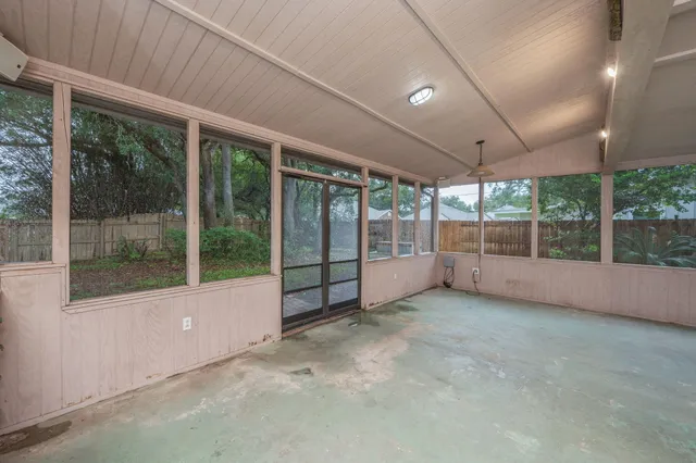 a view of an empty room with a large window