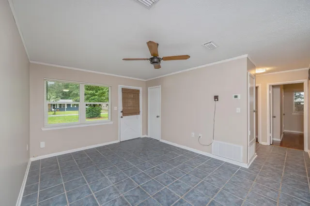 a view of an empty room with a window