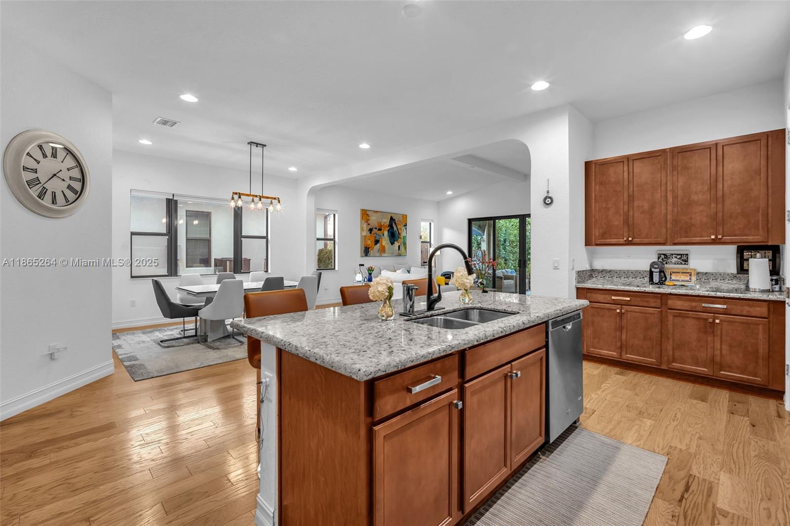 1281 Southwest 113th Way, Unit 1281 Pembroke Pines, FL 33025 - Photo 16 of 38 a kitchen with stainless steel appliances granite countertop a sink counter space and cabinets