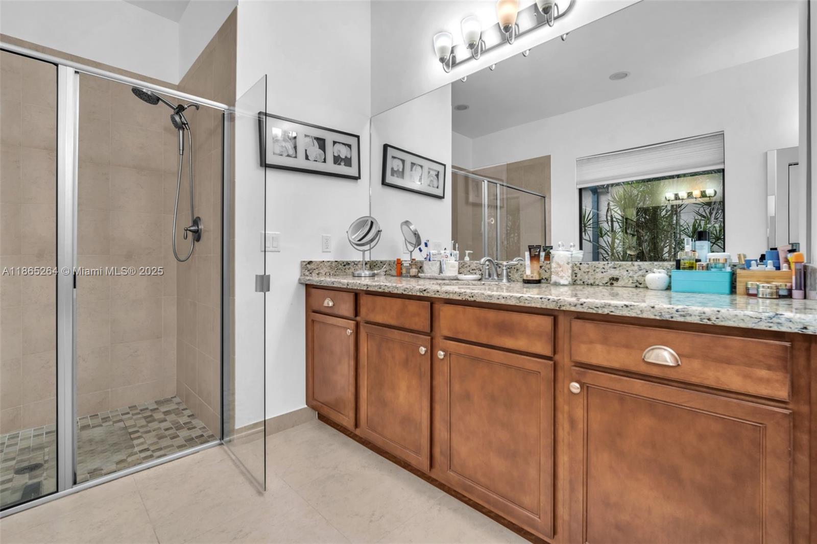 1281 Southwest 113th Way, Unit 1281 Pembroke Pines, FL 33025 - Photo 19 of 38 a bathroom with a sink and a mirror