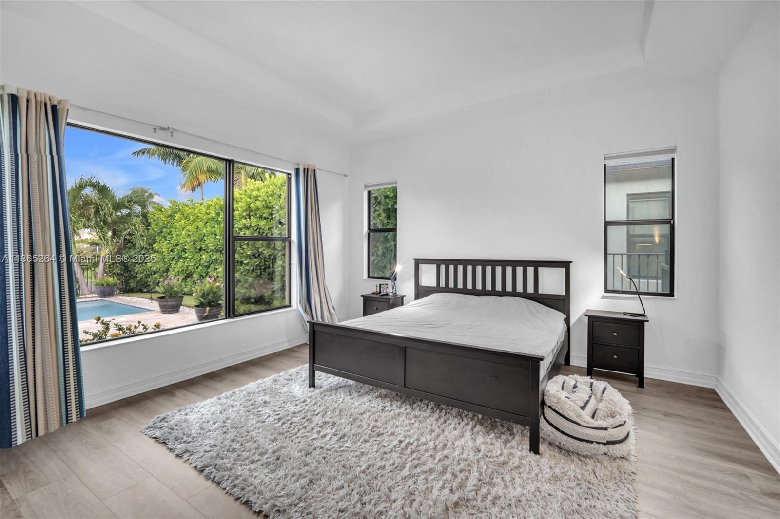 1281 Southwest 113th Way, Unit 1281 Pembroke Pines, FL 33025 - Photo 22 of 38 a living room with a bed and a window