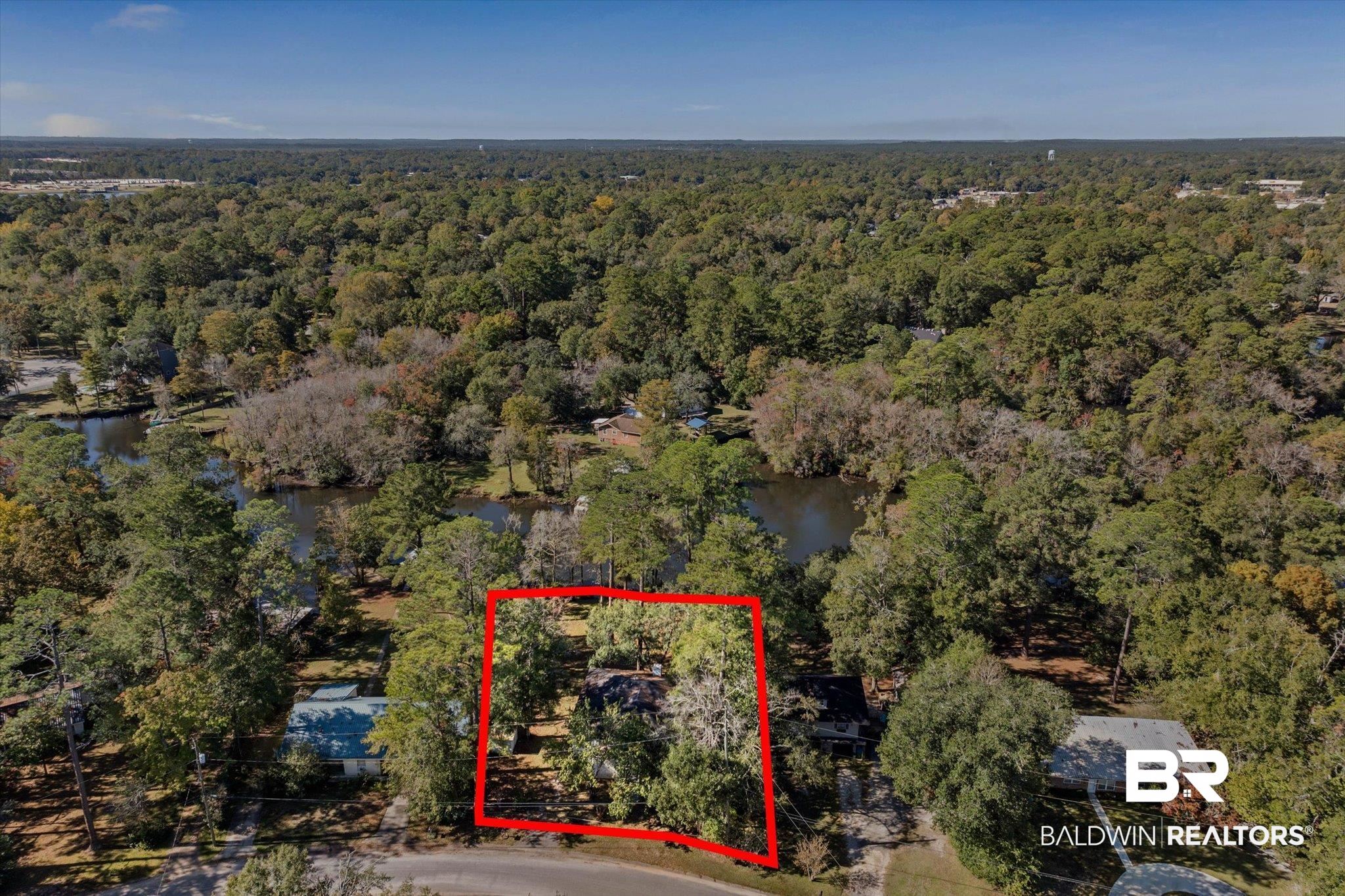 431 Simms Drive Saraland, AL 36571 - Photo 30 of 34 Aerial view of property's location featuring property parcel outlined and a large body of water