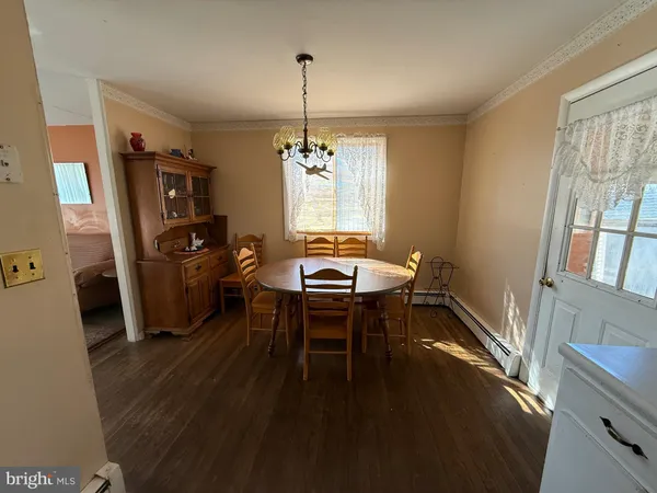 a living room with furniture a window and a table