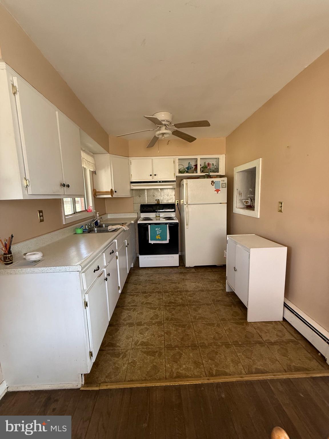 283 Kelton Road West Grove, PA 19390 - Photo 12 of 17 a large white kitchen with a stove a refrigerator a sink and dishwasher