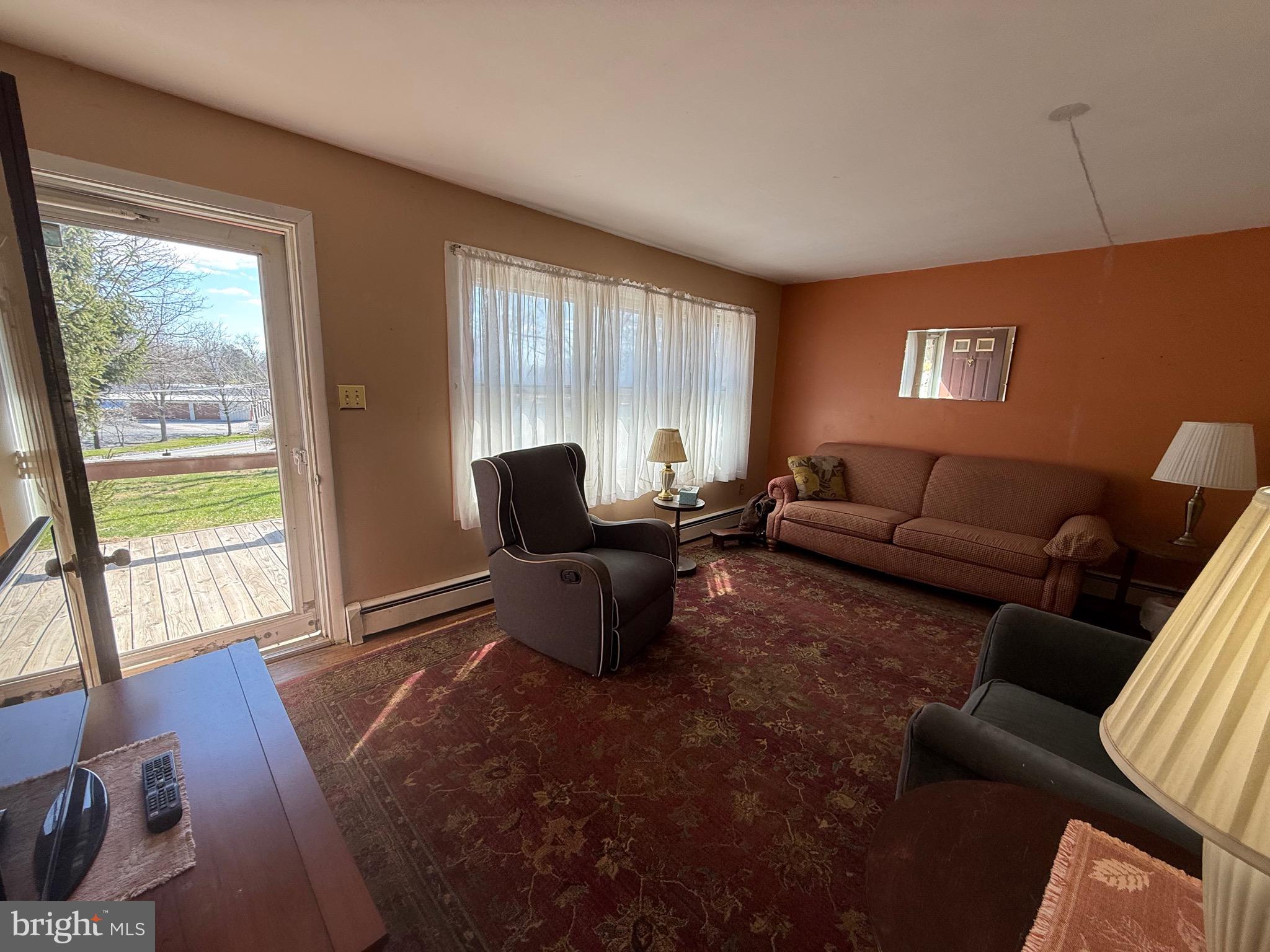283 Kelton Road West Grove, PA 19390 - Photo 8 of 17 a living room with furniture and a window