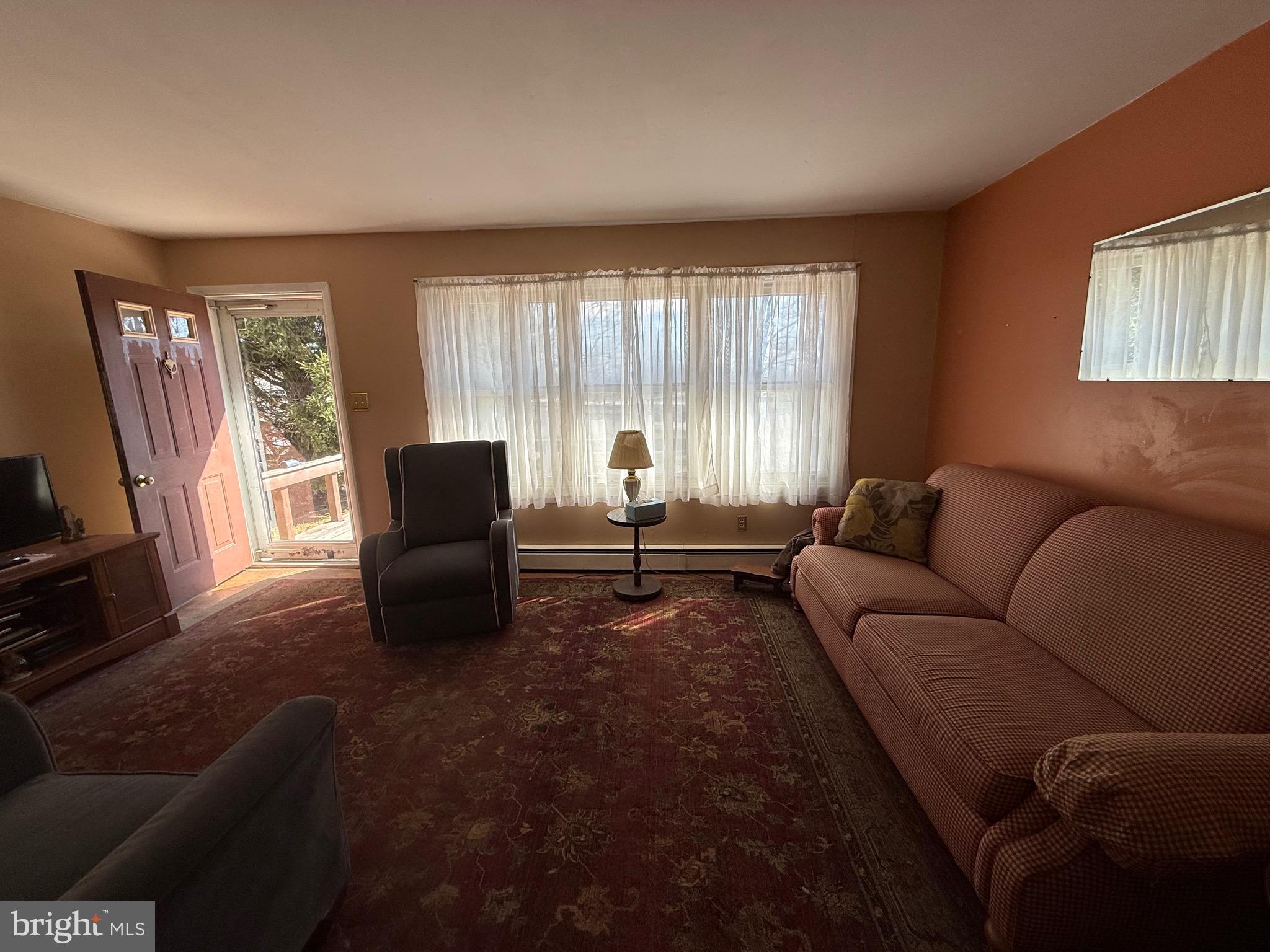 283 Kelton Road West Grove, PA 19390 - Photo 9 of 17 a living room with furniture and a window