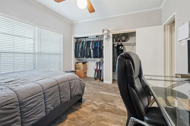 a bedroom with furniture and a window