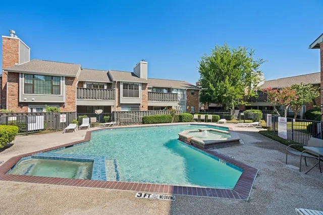 a view of a house with sitting area and swimming pool