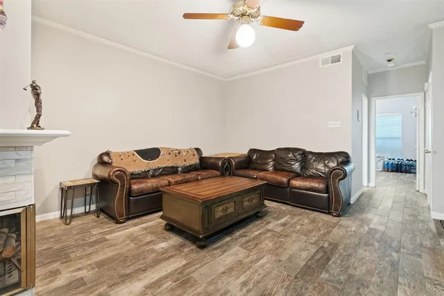 a living room with couches and a fireplace