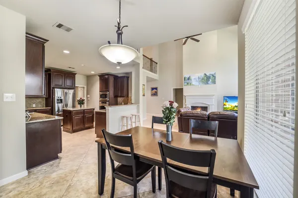 a spacious bathroom with a granite countertop tub sink shower and mirror