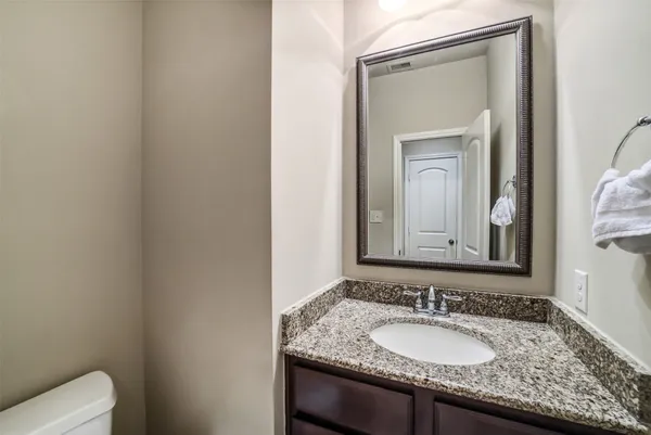 a large bed sitting in a room next to a window