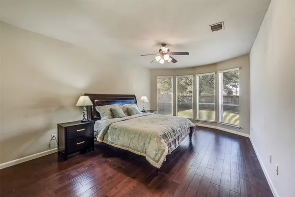 a bathroom with a sink a toilet and shower curtain