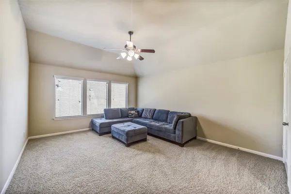 an aerial view of a pool a yard basket ball court and outdoor seating