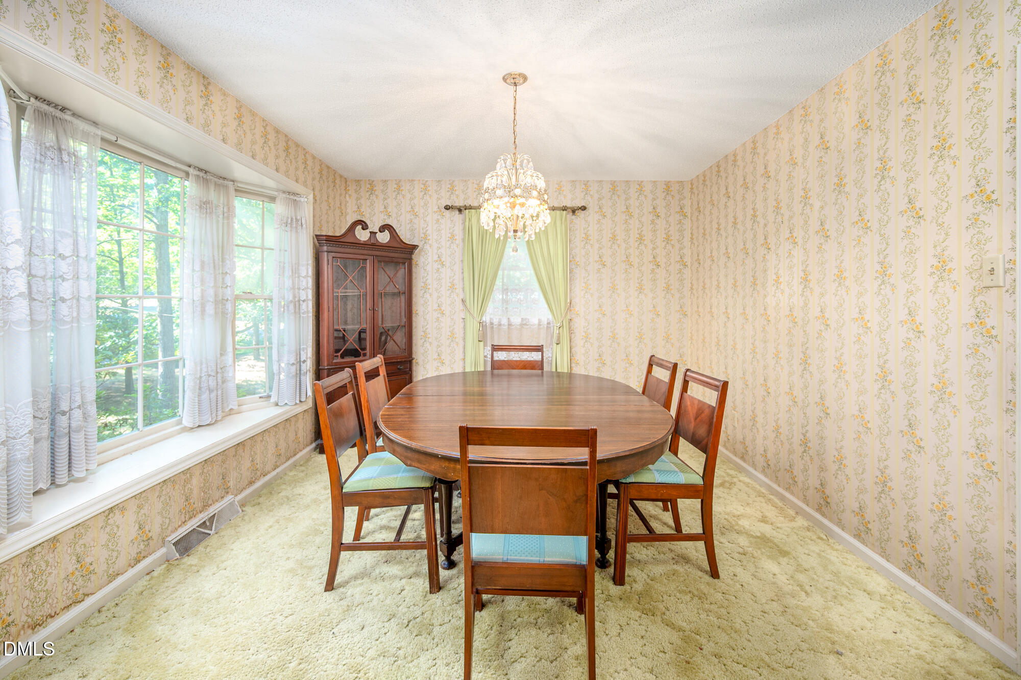 4411 Rhew Drive Durham, NC 27704 - Photo 10 of 34 a view of a dining room with furniture window and outside view
