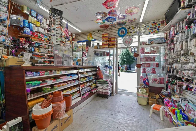 a kitchen with granite countertop a sink dishwasher stove and wooden cabinets
