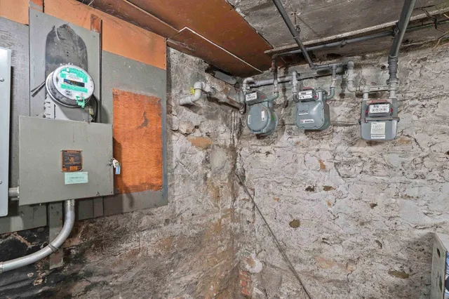 a kitchen with stainless steel appliances granite countertop a stove a refrigerator and a wooden cabinets