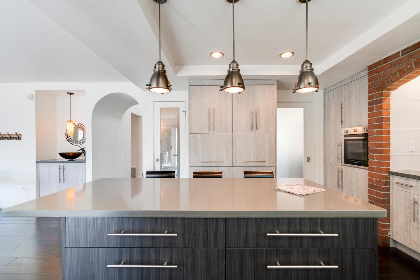 2257 Glenview Drive Milpitas, CA 95035 - Photo 13 of 28 a kitchen with kitchen island stainless steel appliances a sink and a wooden floor
