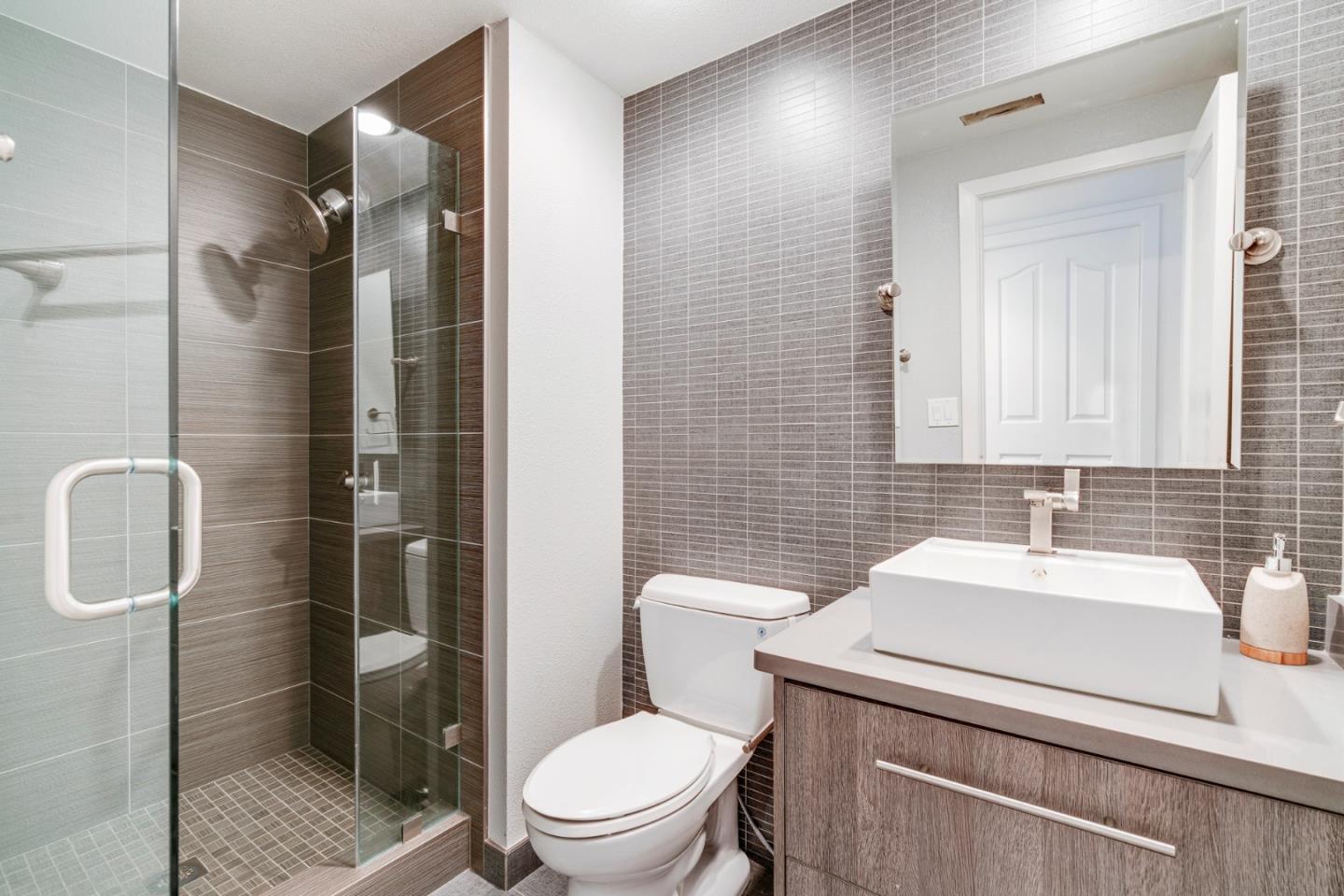 2257 Glenview Drive Milpitas, CA 95035 - Photo 15 of 28 a bathroom with a sink toilet and shower