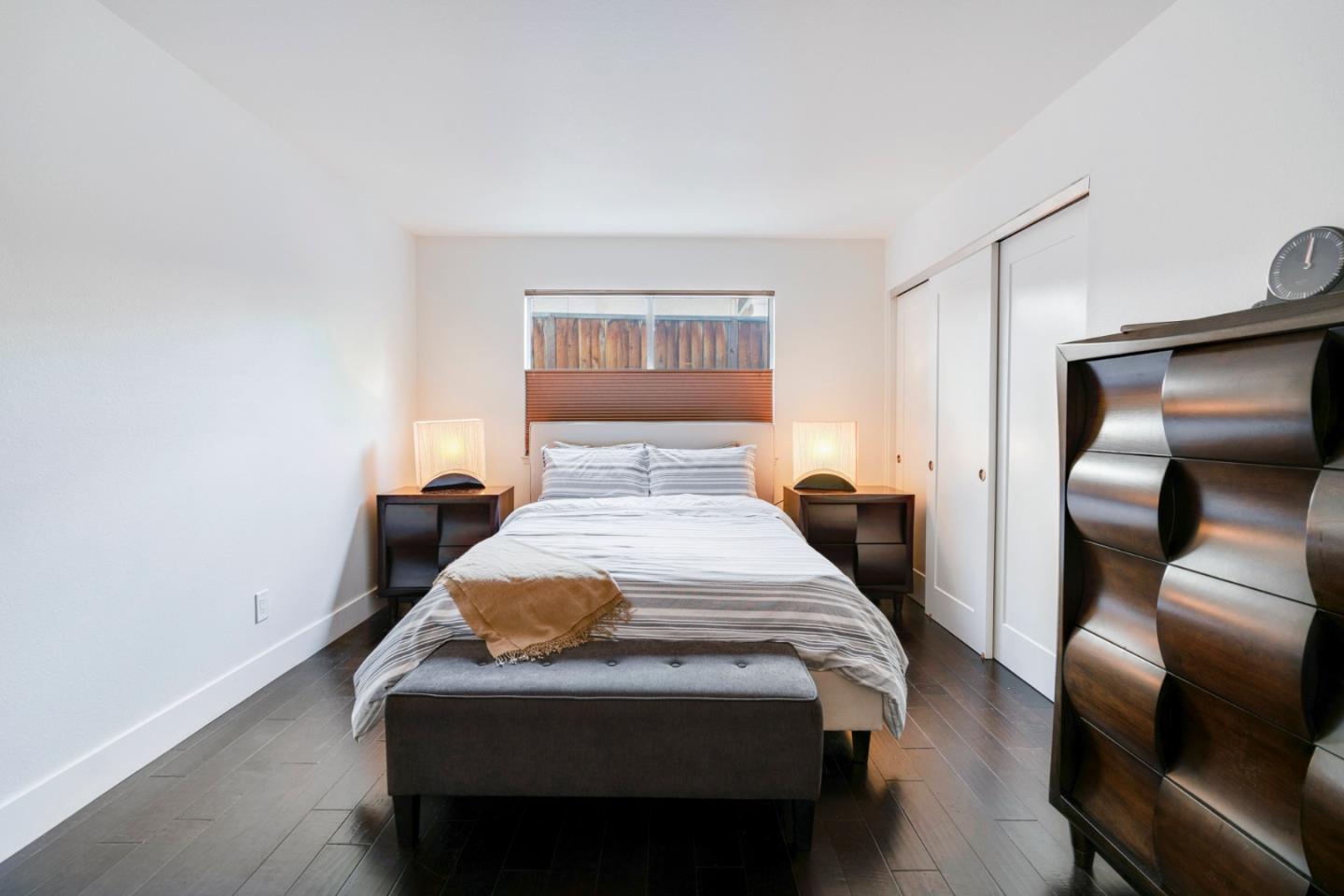 2257 Glenview Drive Milpitas, CA 95035 - Photo 16 of 28 a bedroom with a bed and wooden floor