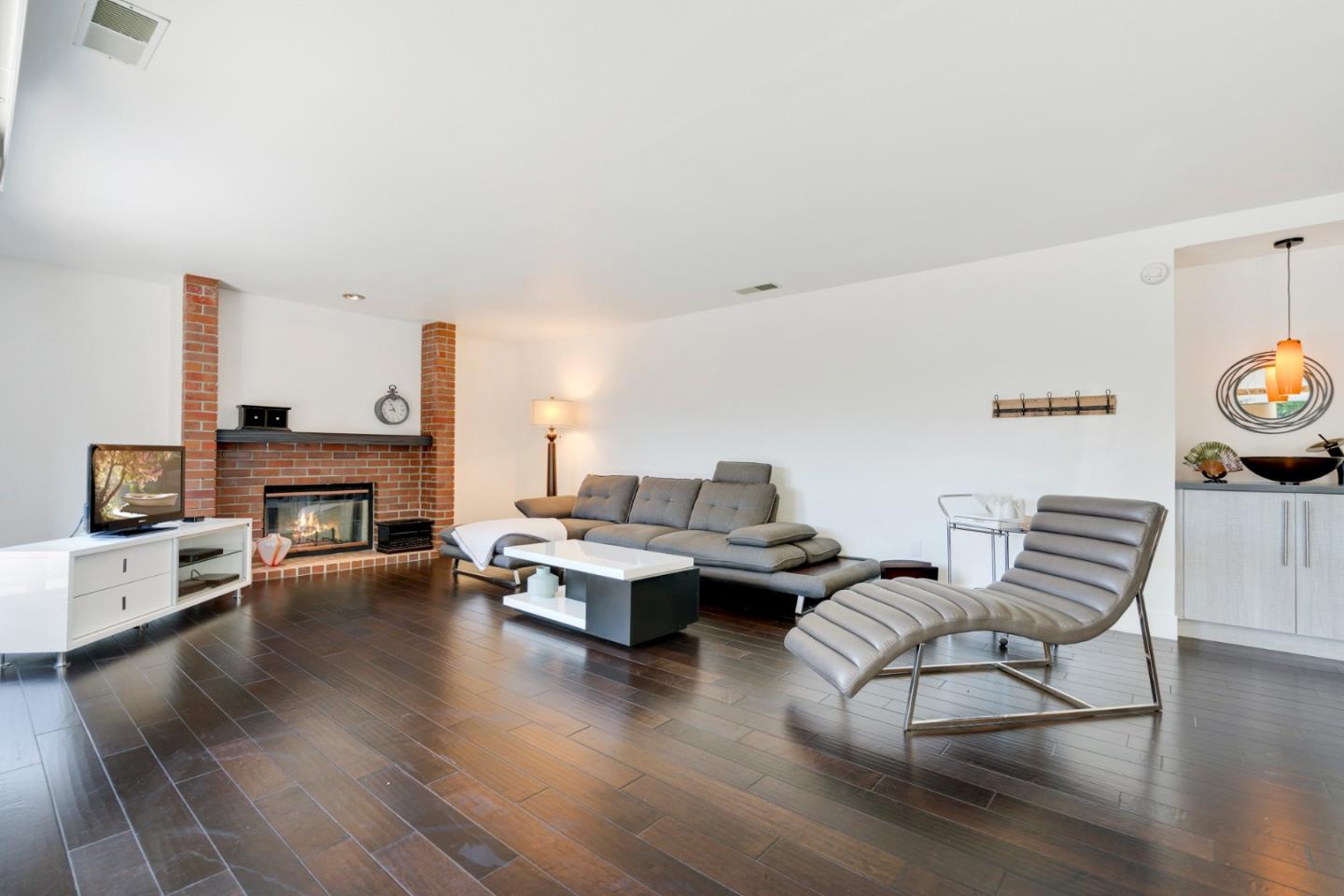 2257 Glenview Drive Milpitas, CA 95035 - Photo 4 of 28 a living room with fireplace furniture and a wooden floor