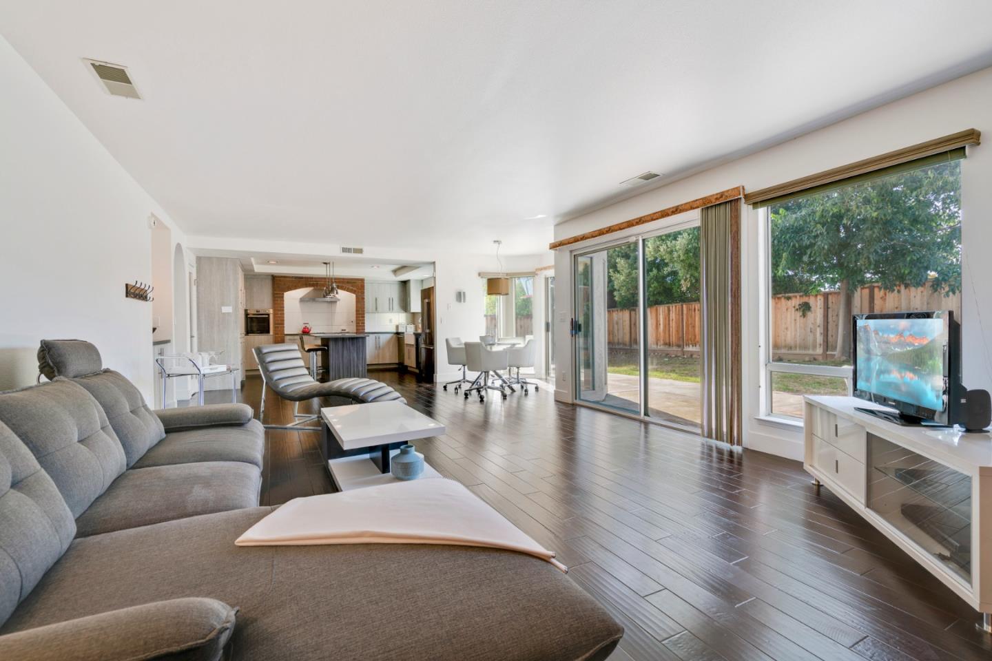 2257 Glenview Drive Milpitas, CA 95035 - Photo 7 of 28 a living room with furniture large windows and wooden floor
