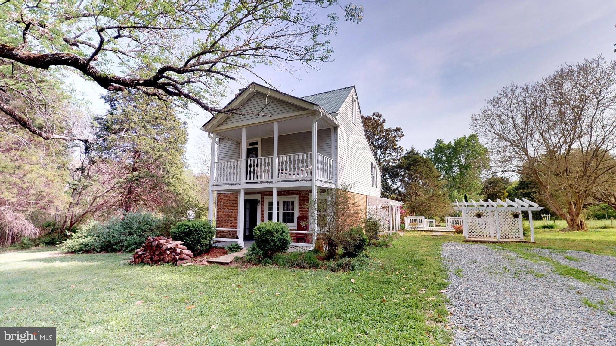 527 Hawkins Farm Road Bumpass, VA 23024 - Photo 1 of 30 a view of a house with yard and a garden