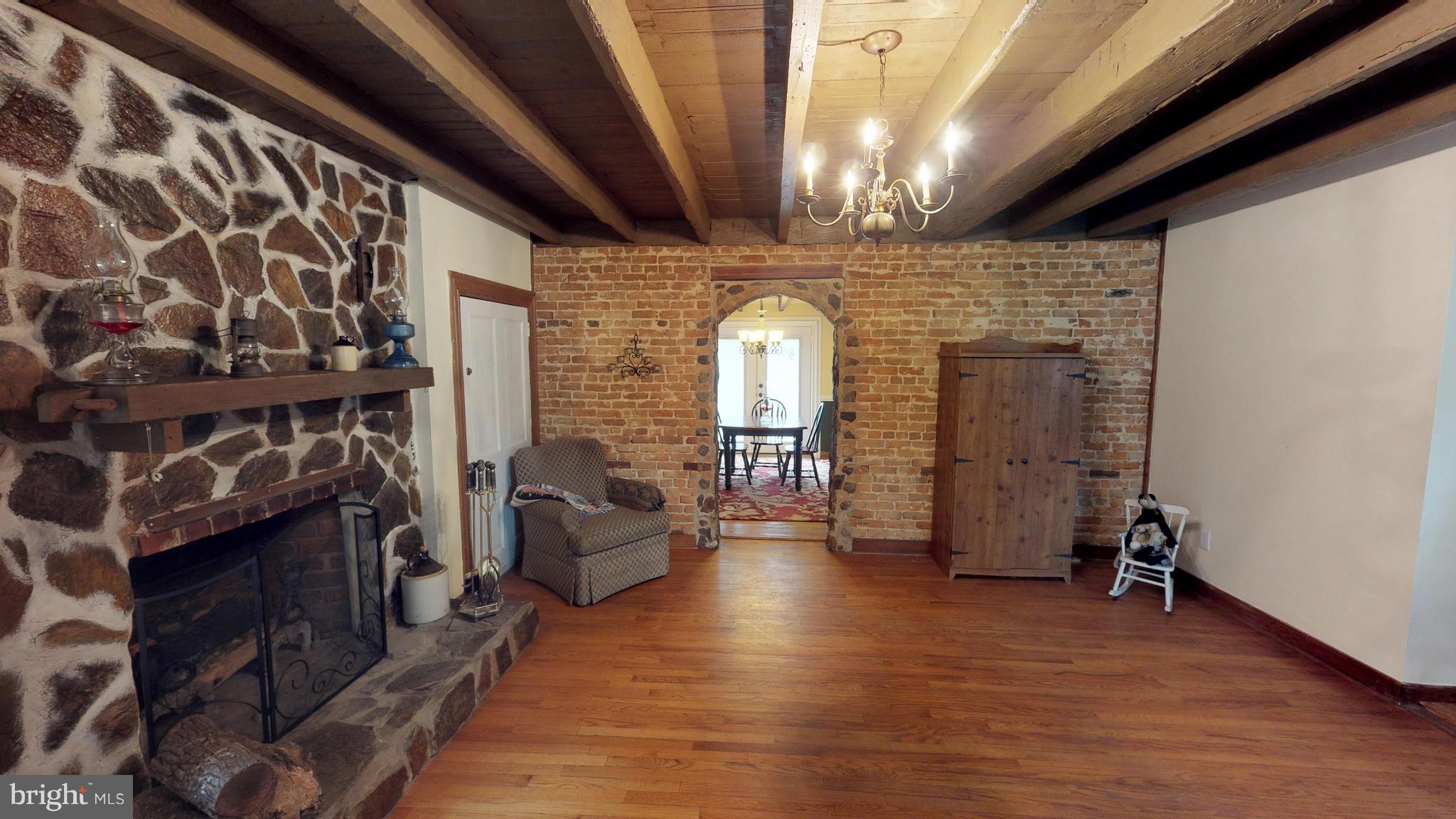 527 Hawkins Farm Road Bumpass, VA 23024 - Photo 12 of 30 a view of a livingroom with furniture and staircase
