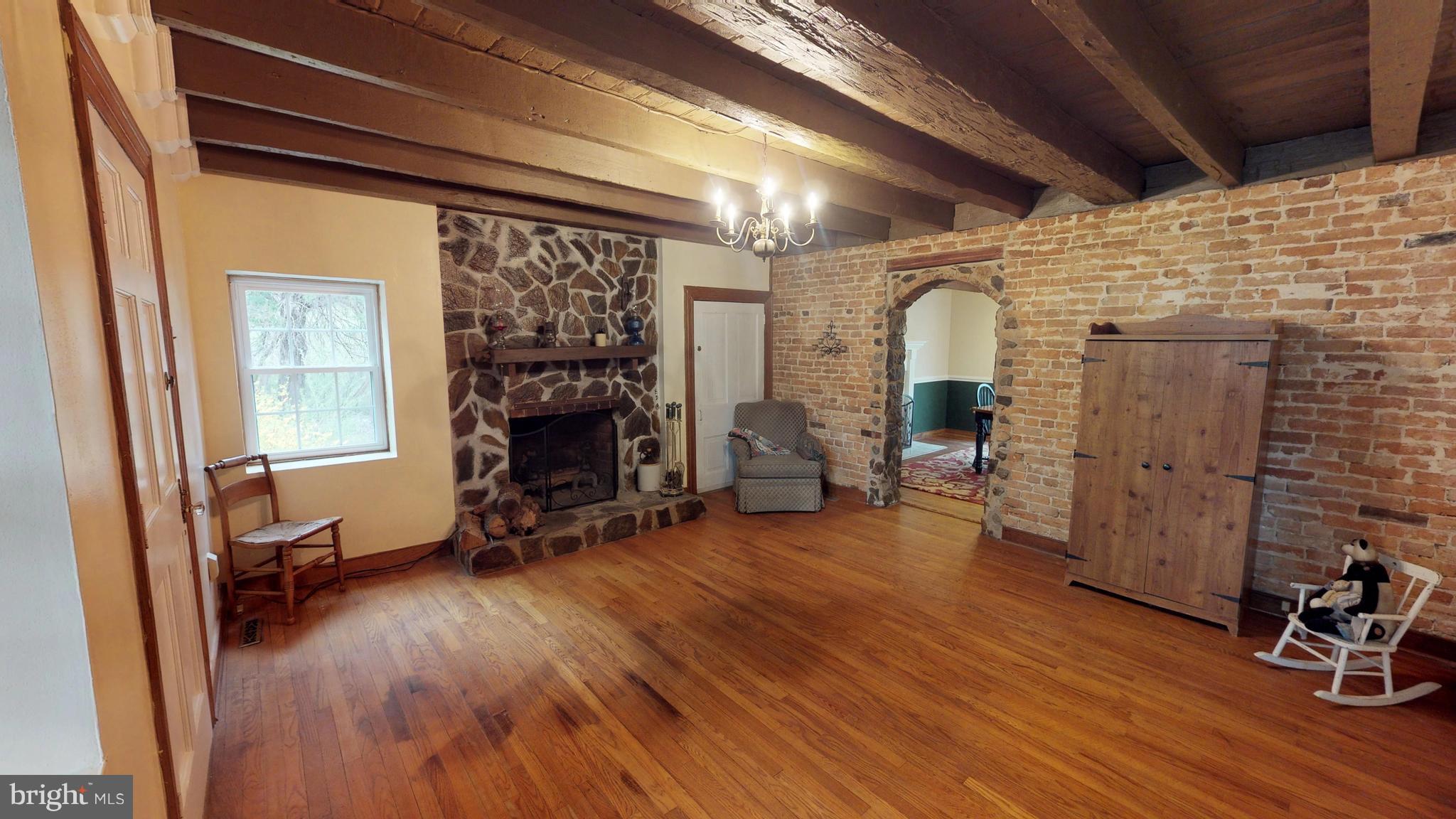 527 Hawkins Farm Road Bumpass, VA 23024 - Photo 13 of 30 a view of a livingroom with furniture and a fireplace