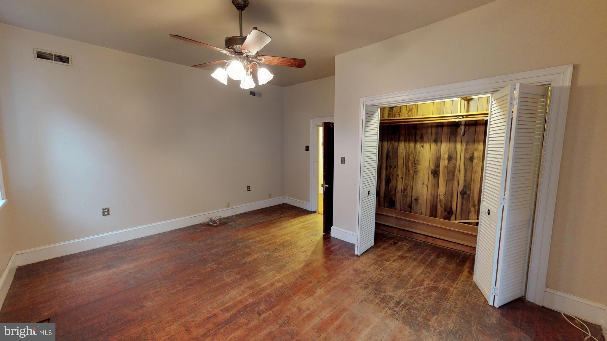527 Hawkins Farm Road Bumpass, VA 23024 - Photo 24 of 30 a view of an empty room with wooden floor